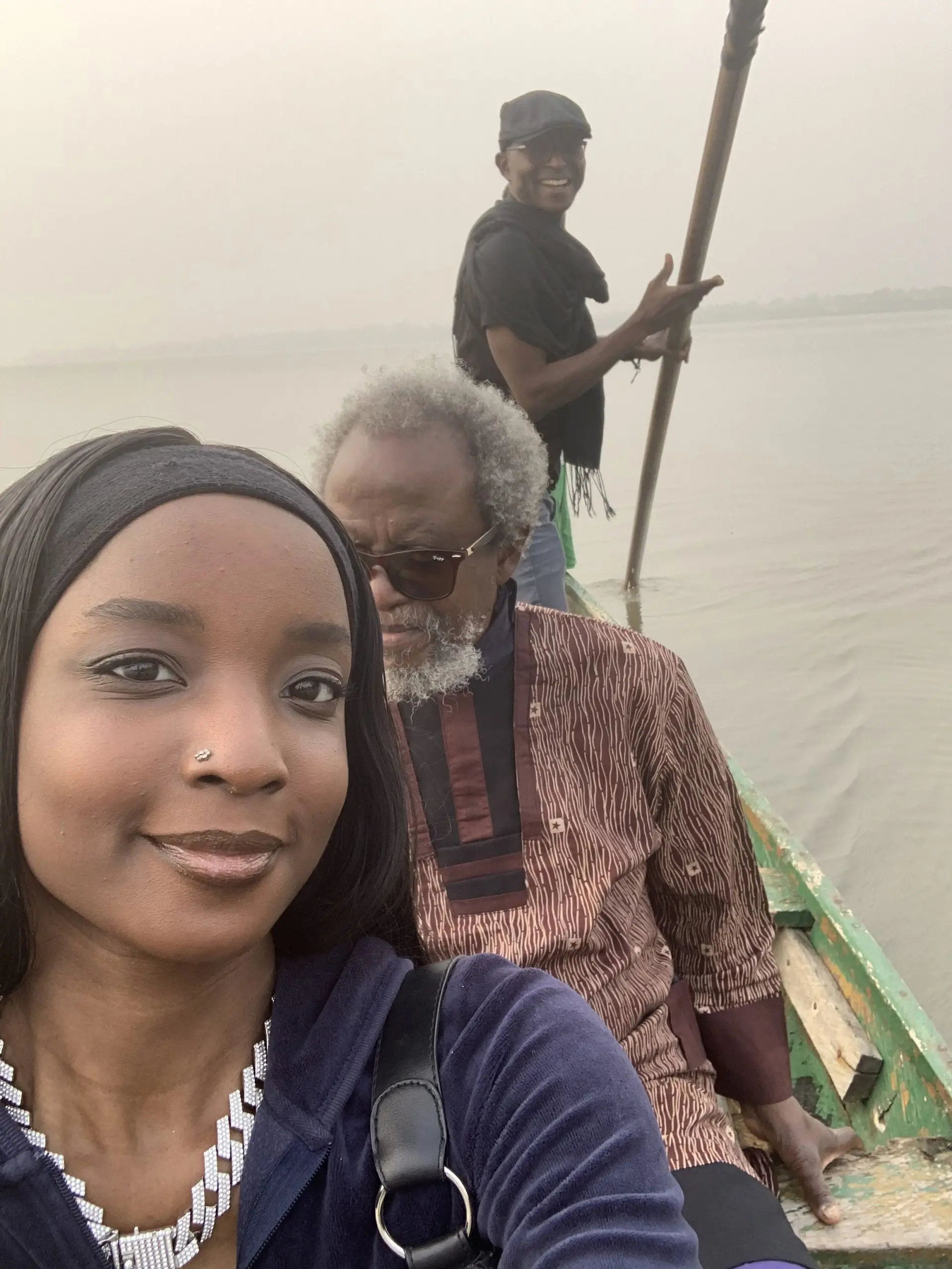 Richard Meseko and a companion in a boat.