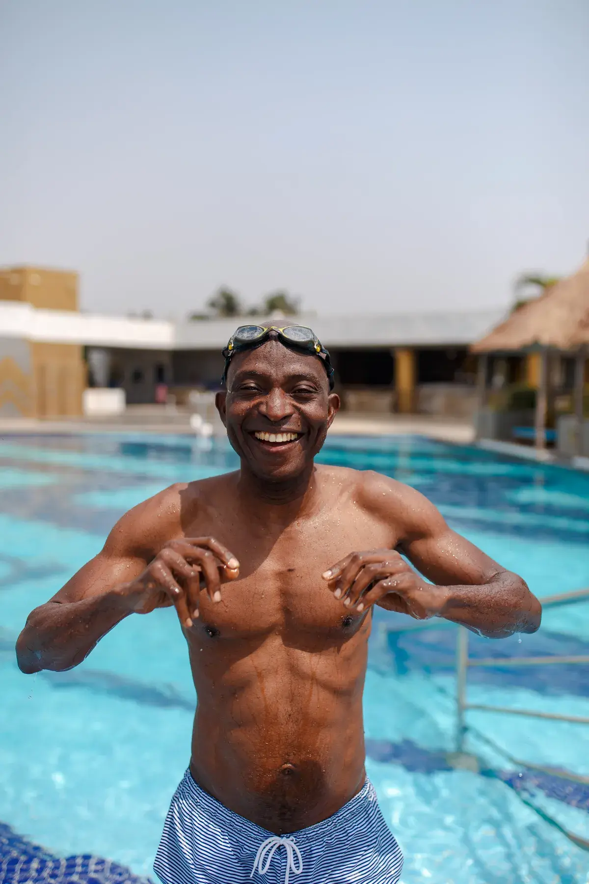 Richard Meseko smiling in a swimming pool.