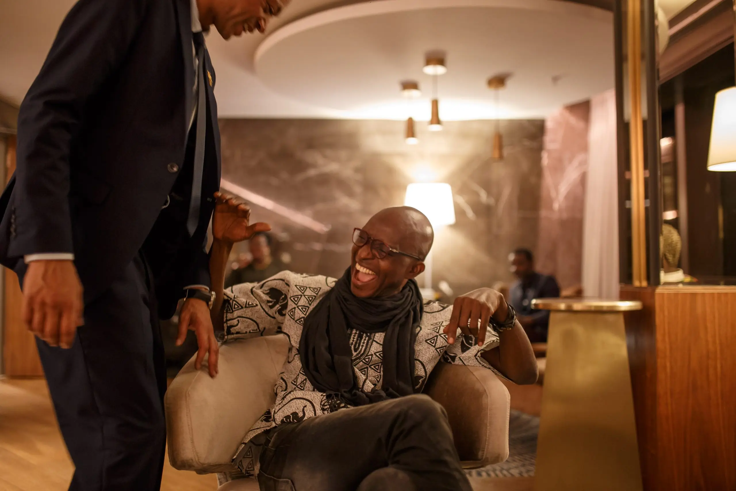 Richard Meseko seated in a dim lounge.